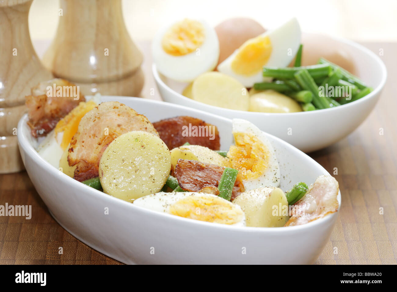 Fresh Healthy Summer Meal Of Hard Boiled Eggs With New Potatoes Bacon And Green Beans And No People Stock Photo