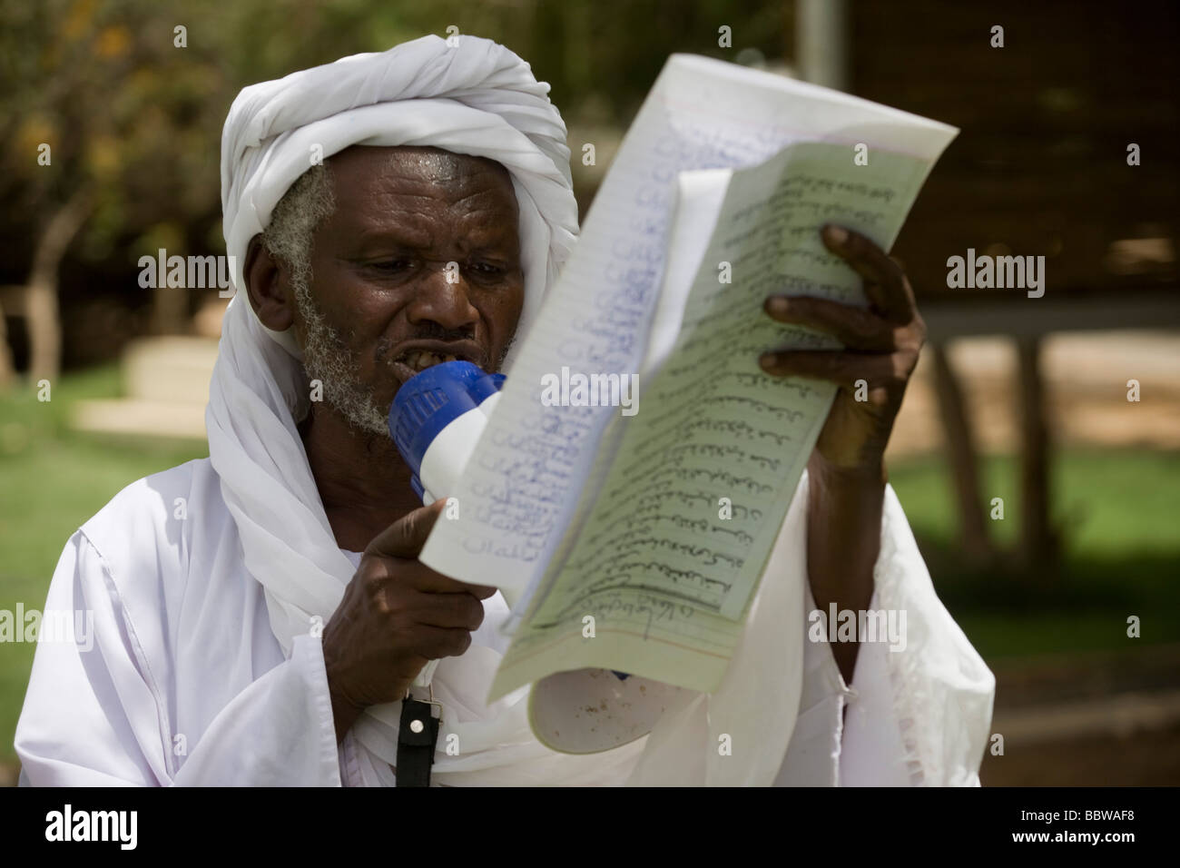 A traditional story-teller delivers tales from Islamic texts compound belonging to Governor of North Darfur in Al-Fasher Stock Photo