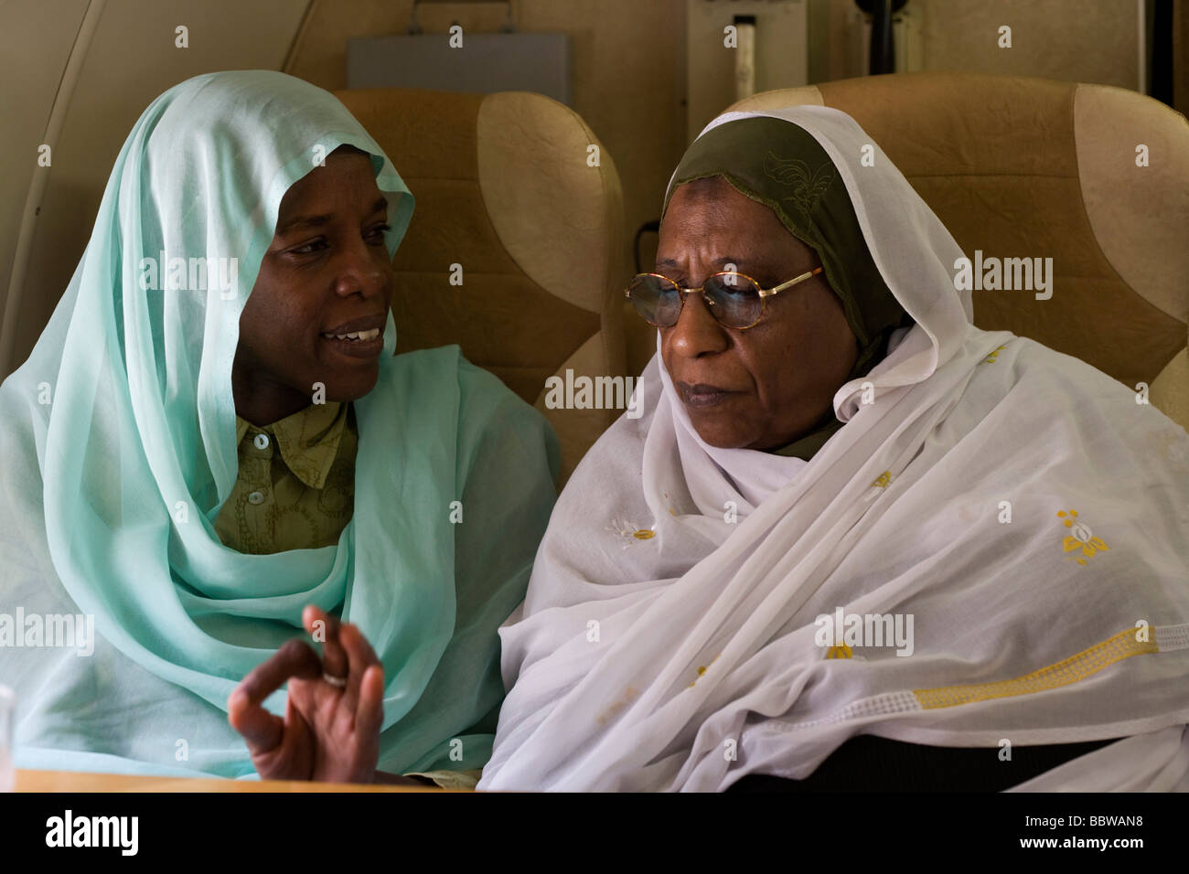 Sudanese women discuss politics on Russian airliner to first-ever international Conference on Womens' Challenge in Darfur Stock Photo