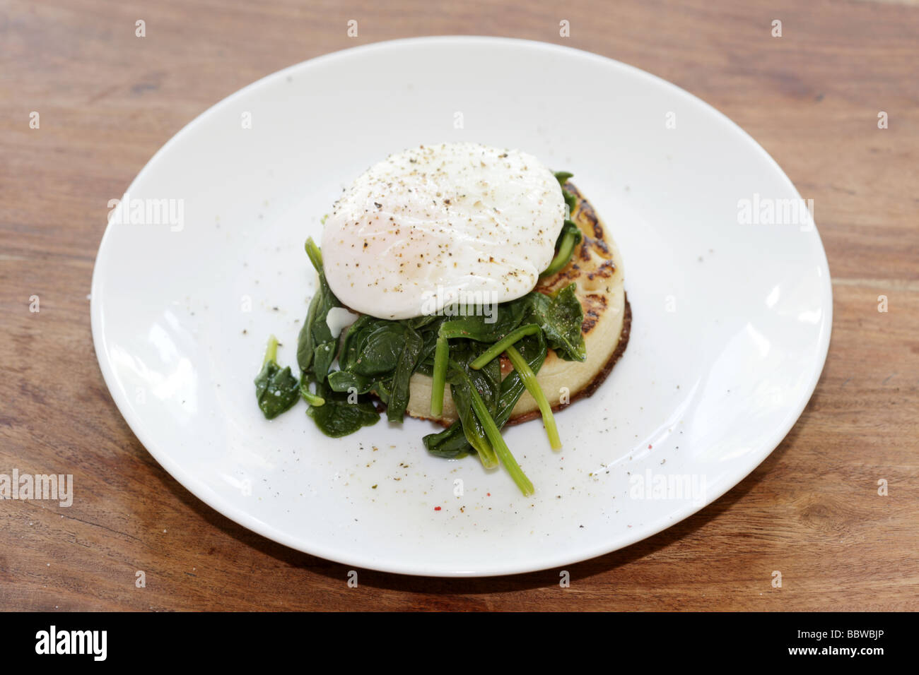 Poached Egg and Spinach Muffin Stock Photo