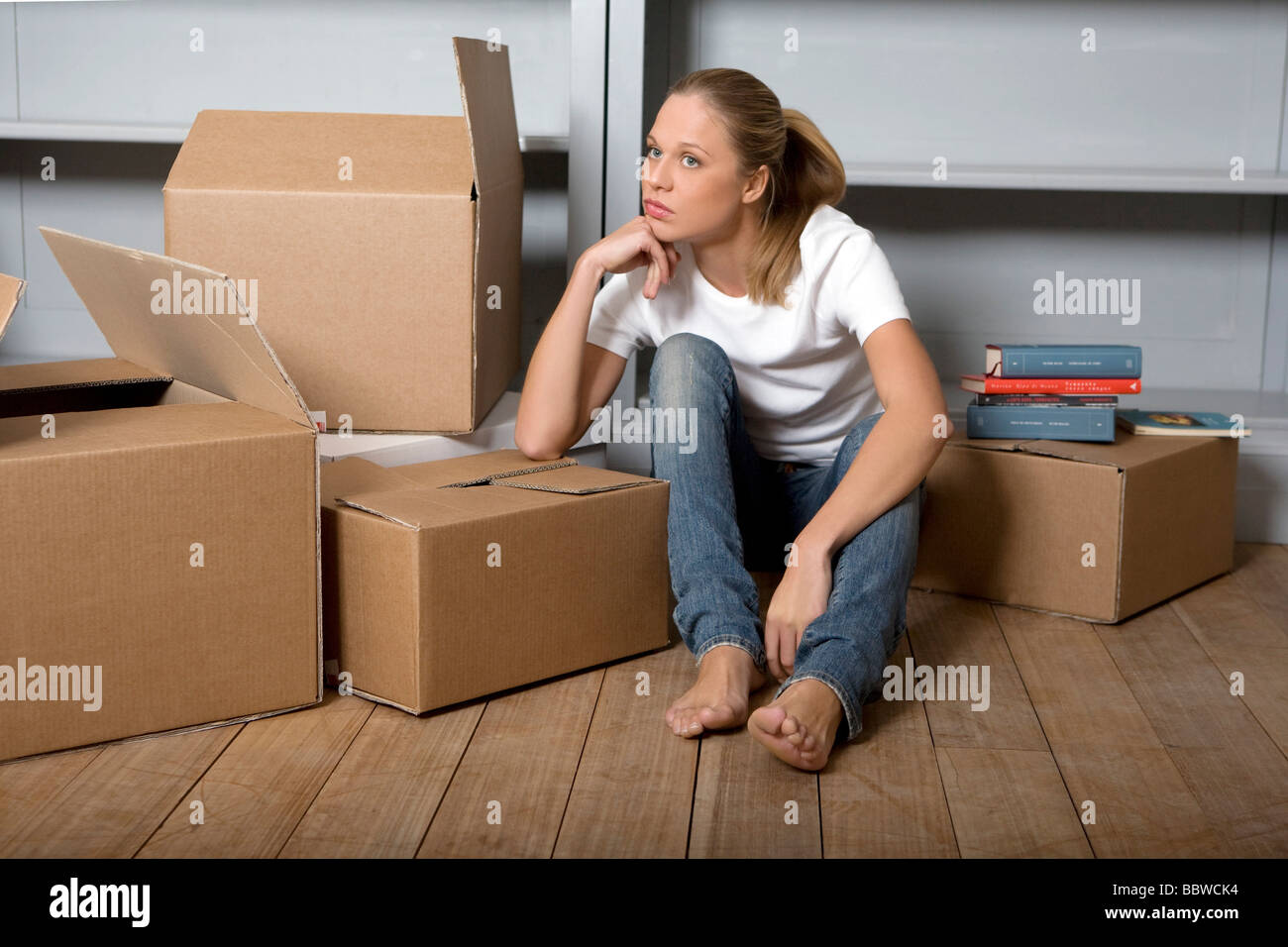 young woman and cartons, removal Stock Photo