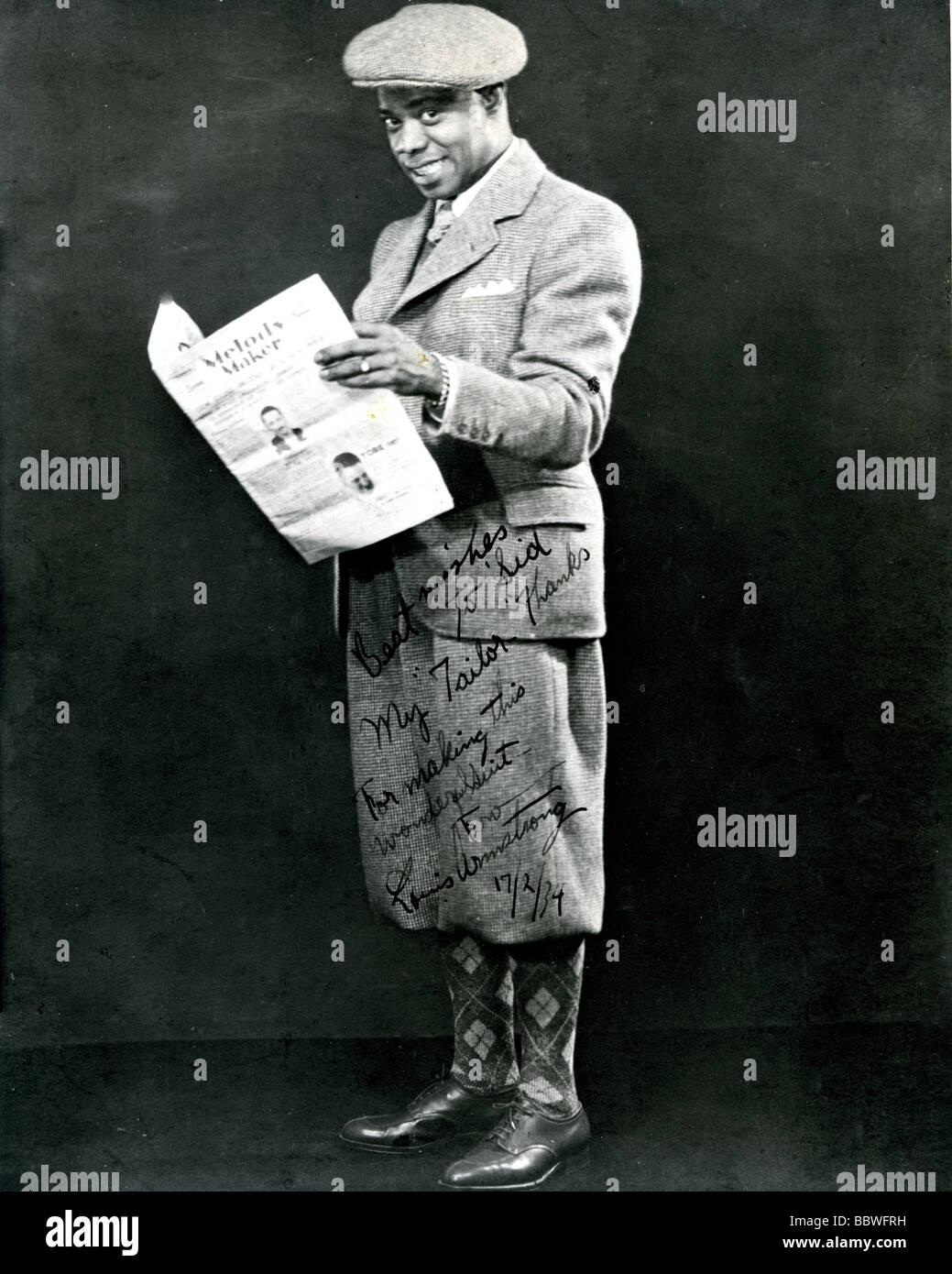 LOUIS ARMSTRONG - US jazz musician in 1934 after a visit to his London tailor to whom he gave this signed photo. Stock Photo