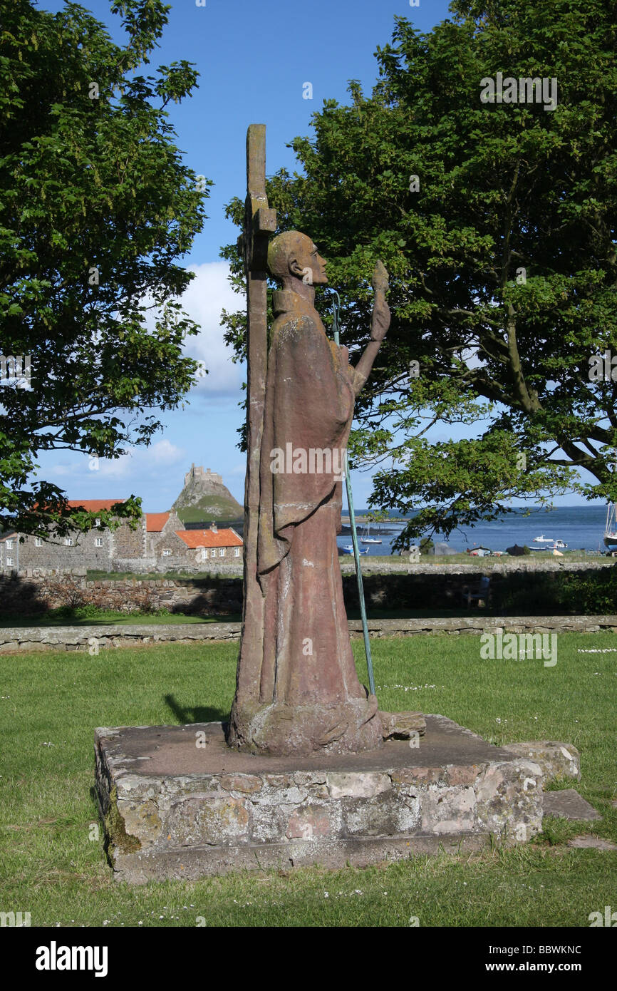 Statue of St Aidan on Holy Island, Northumberland, UK, with Lindisfarne