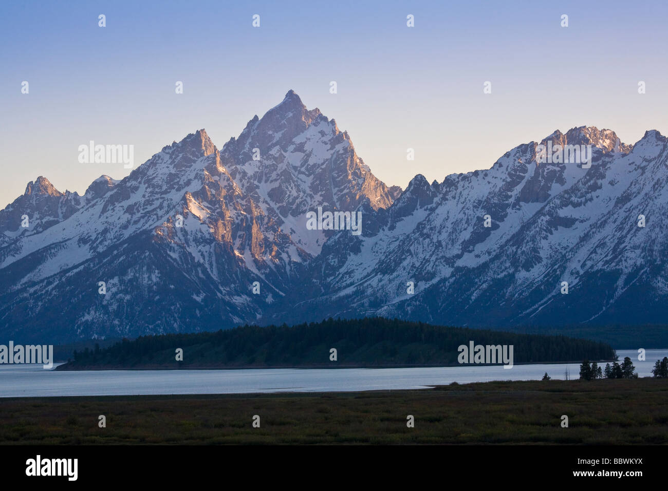 Snow capped mountains at sunset in Grand Teton National Park in Wyoming Stock Photo