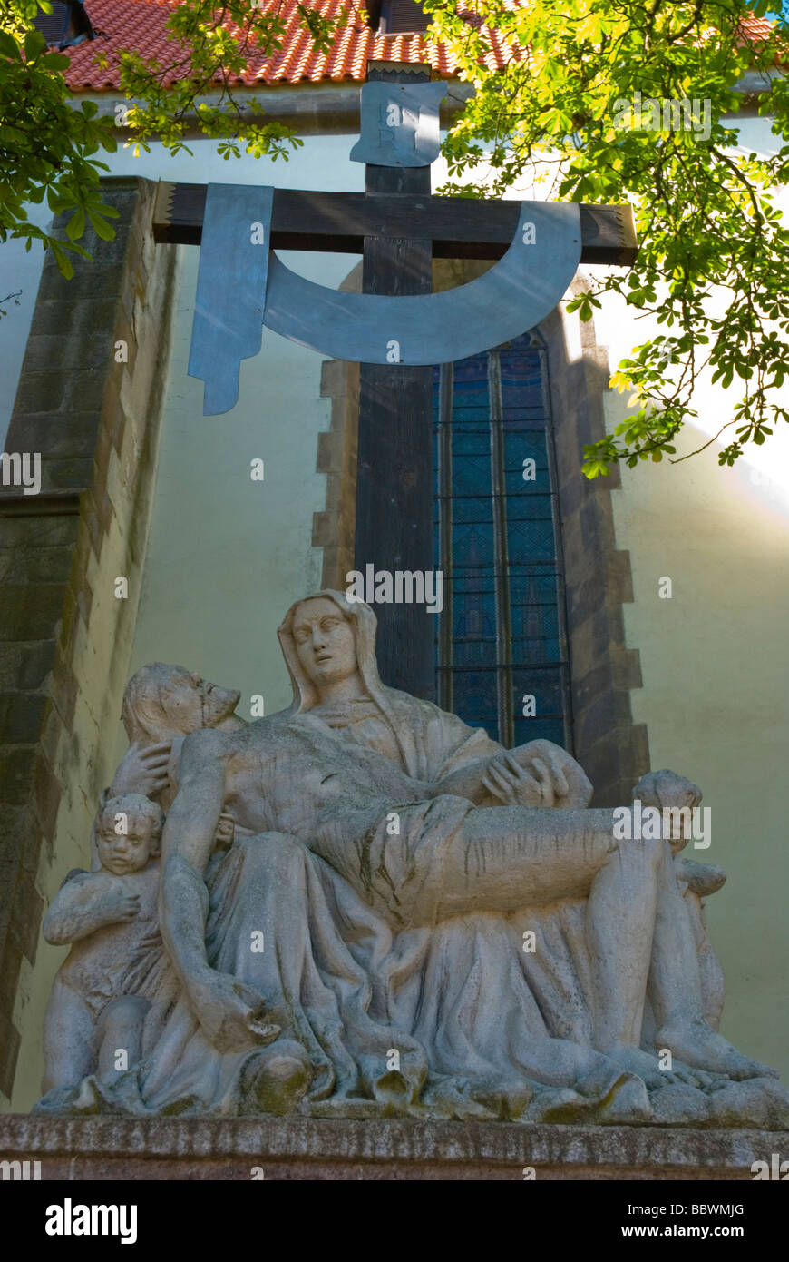 Religious sculpture in front of St Transfiguration church at Zizkovo namesti square in Tabor Czech Republic Europe Stock Photo