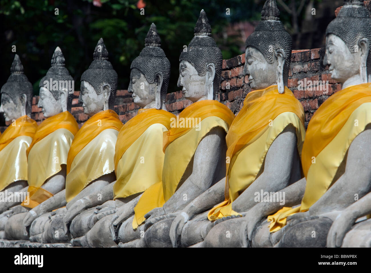 Seated Buddhas row Wat Yai Chai Mongkhon Ayutthaya Thailand Stock Photo