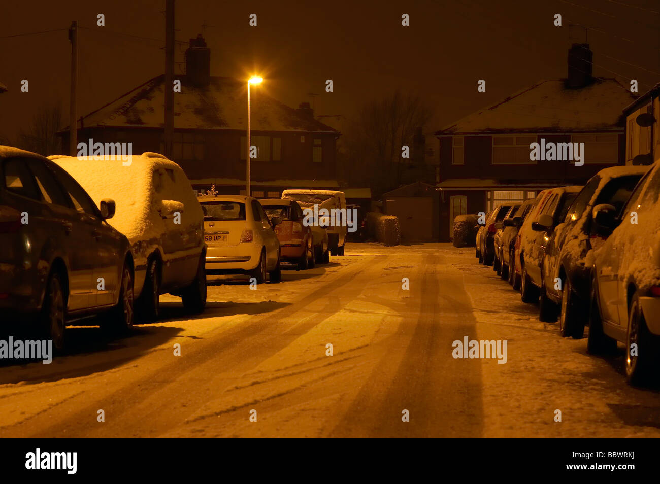 Street light at night in snow covered street hi-res stock photography ...