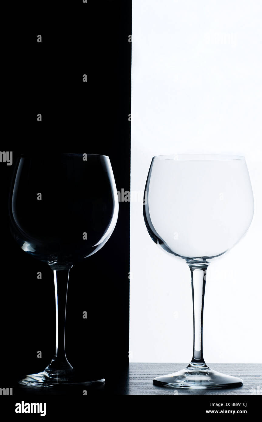 the wine glasses in front of a black and white background Stock Photo