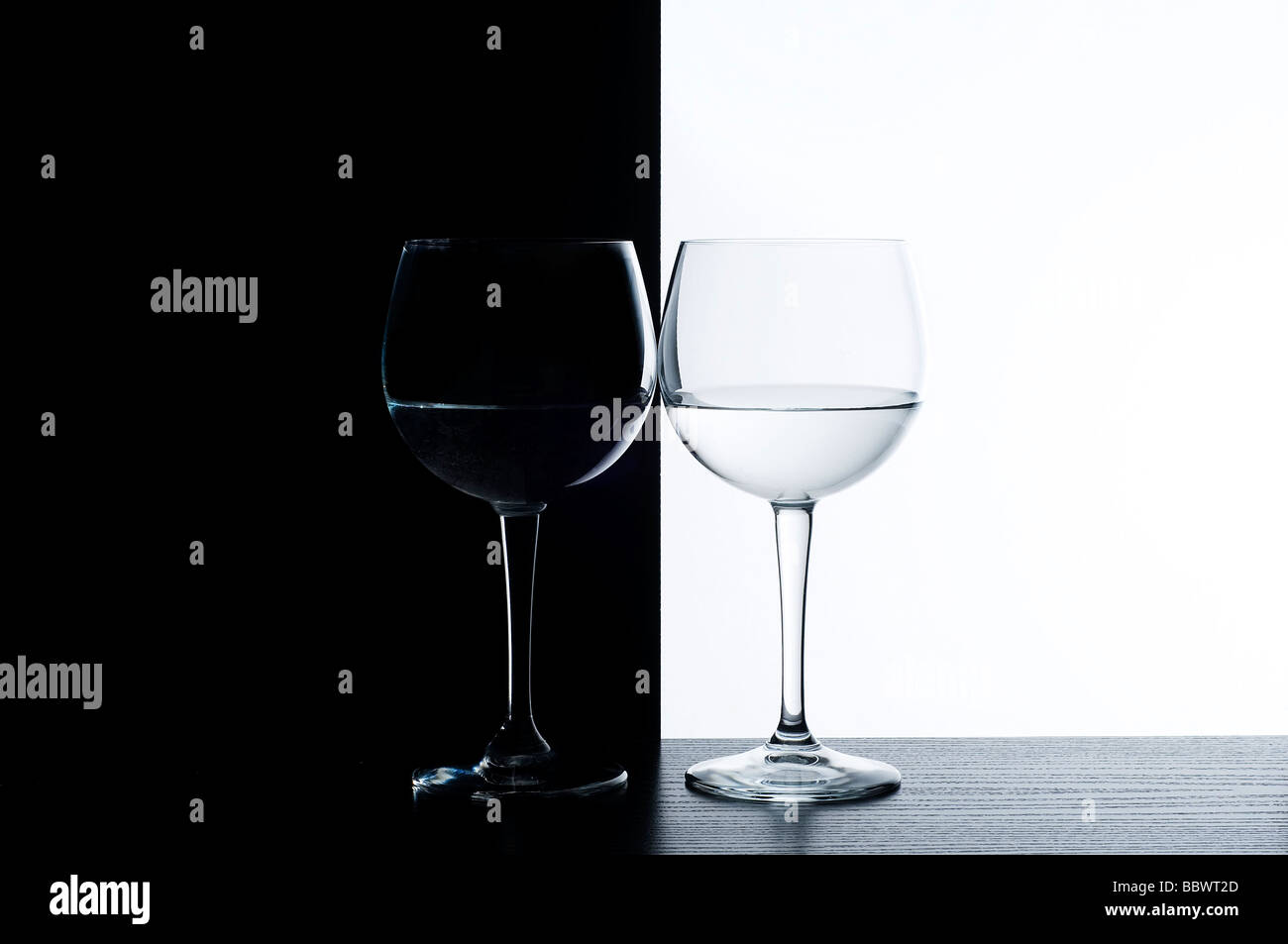 the wine glasses in front of a black and white background Stock Photo