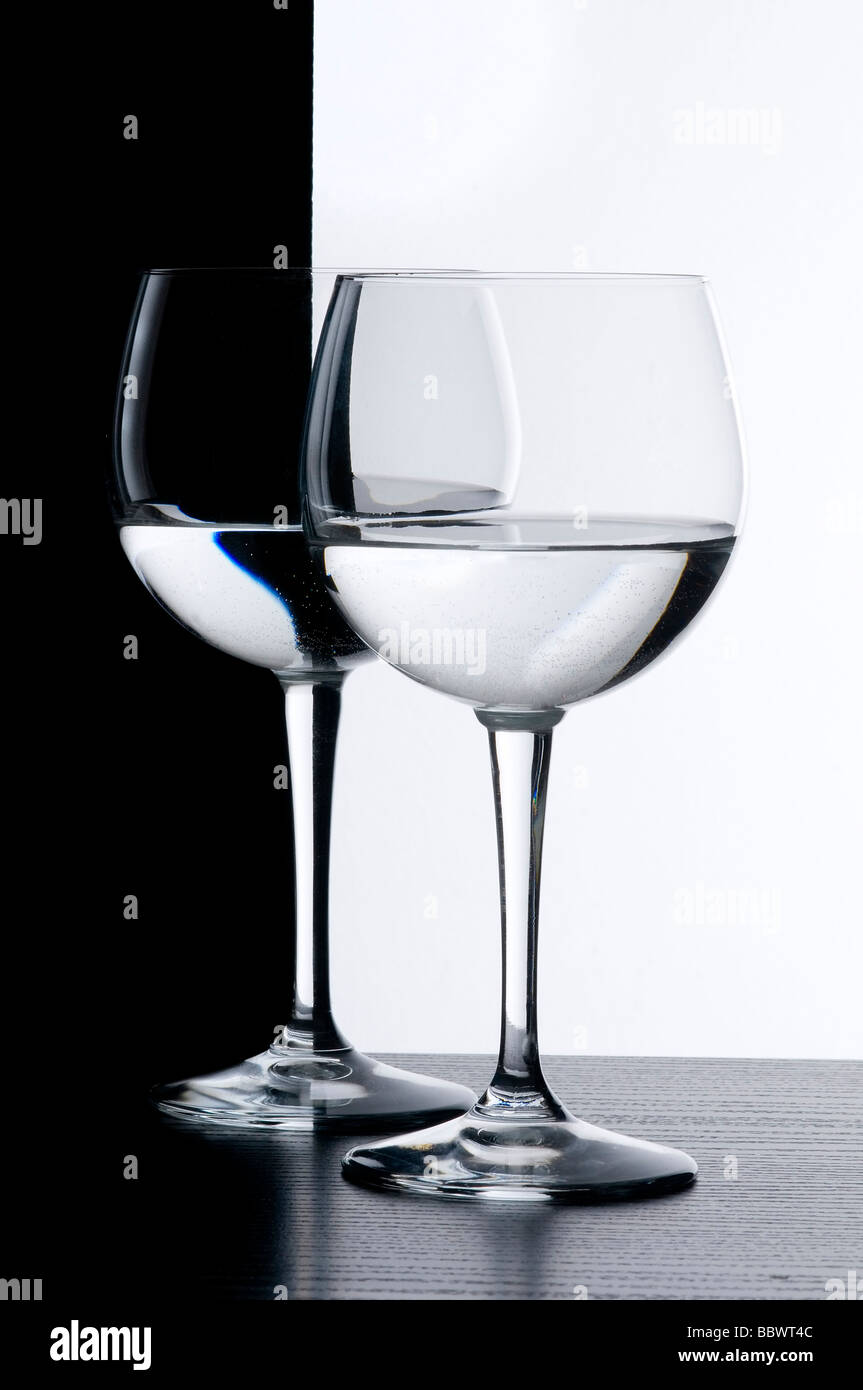 the wine glasses in front of a black and white background Stock Photo