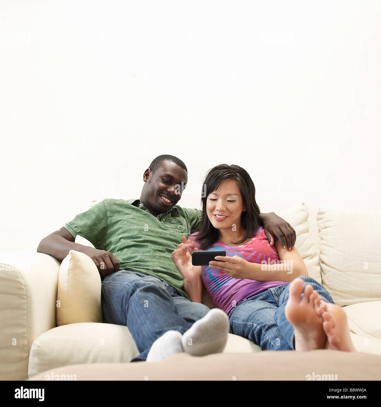 Young people using technology for entertainment Stock Photo