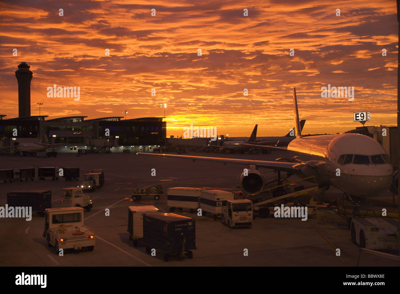Airliners at terminal, sunrise, Houston International Airport Stock