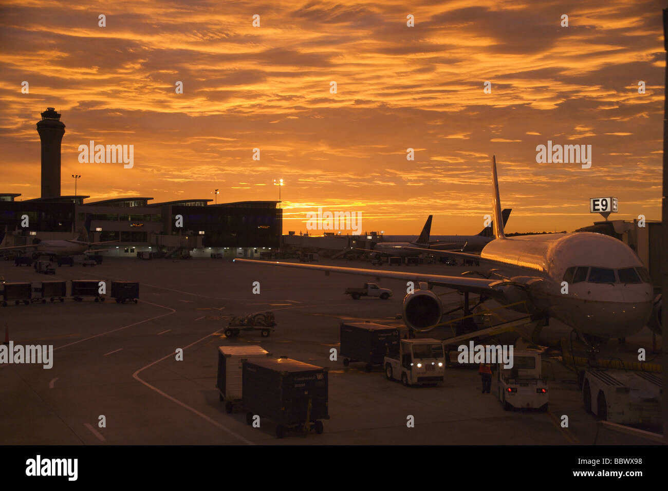 Airliners at terminal, sunrise, Houston International Airport Stock Photo