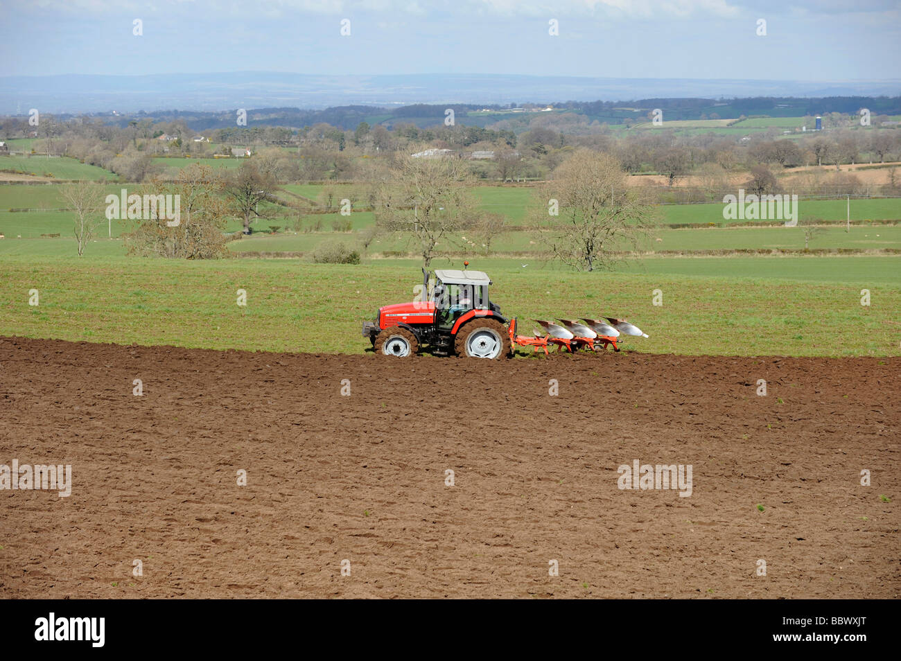 Massey Ferguson tractor ploughing Stock Photo