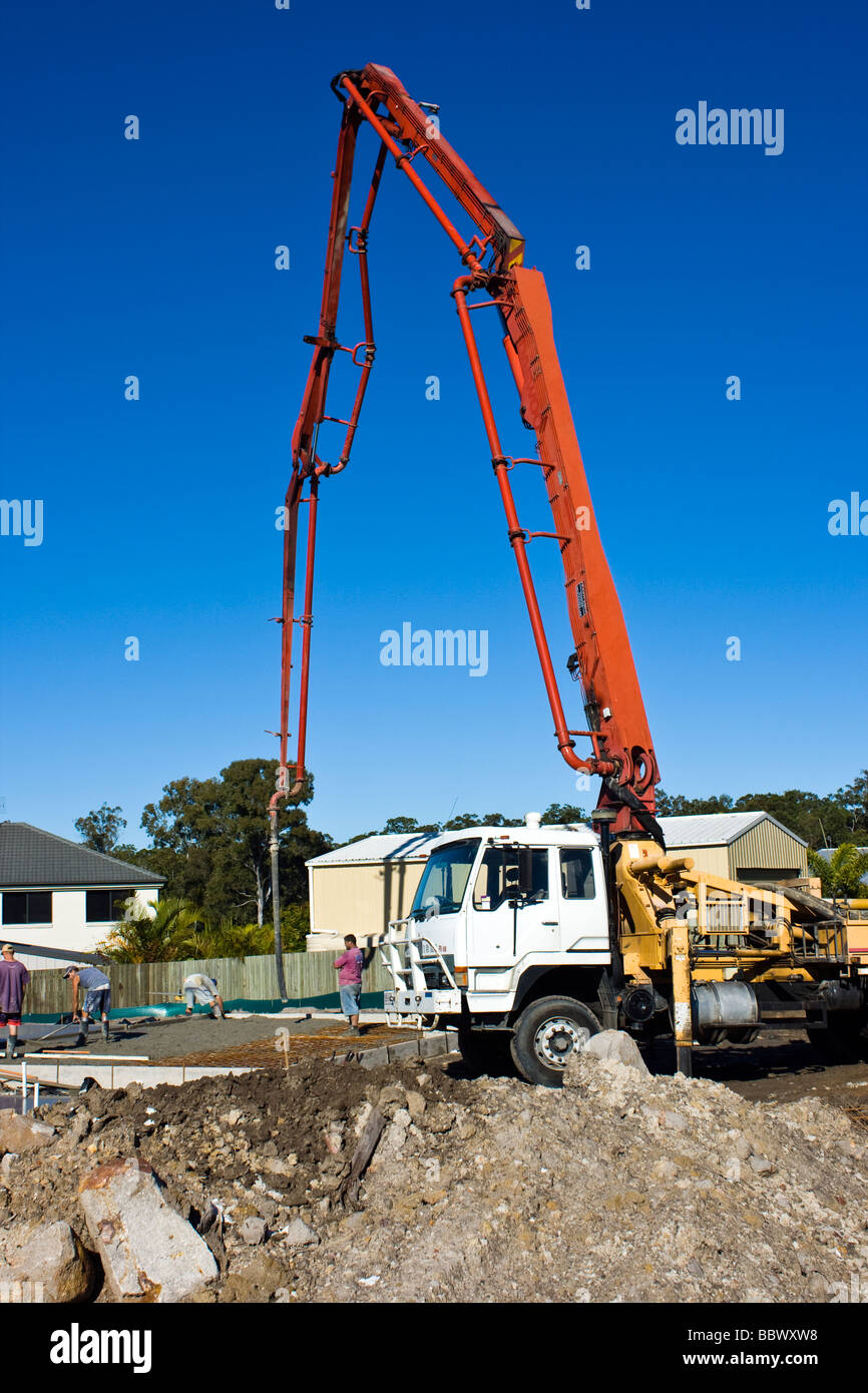 A concrete pump pouring a slab for a new house Stock Photo