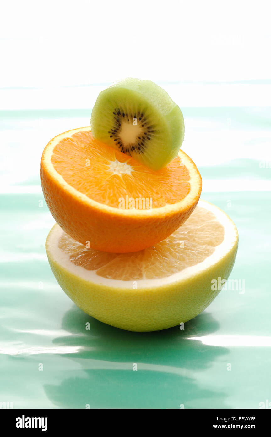 Half Cut of Kiwi Fruit, Orange and Grapefruit Stock Photo