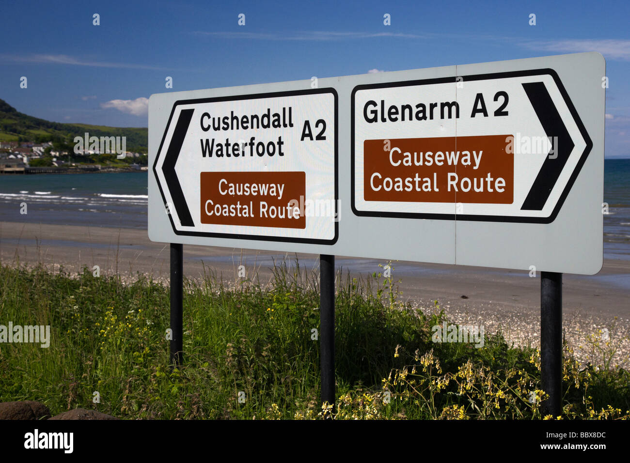 signposts for the causeway coastal route at carnlough between cushendall and glenarm county antrim coast road A2 ni Stock Photo