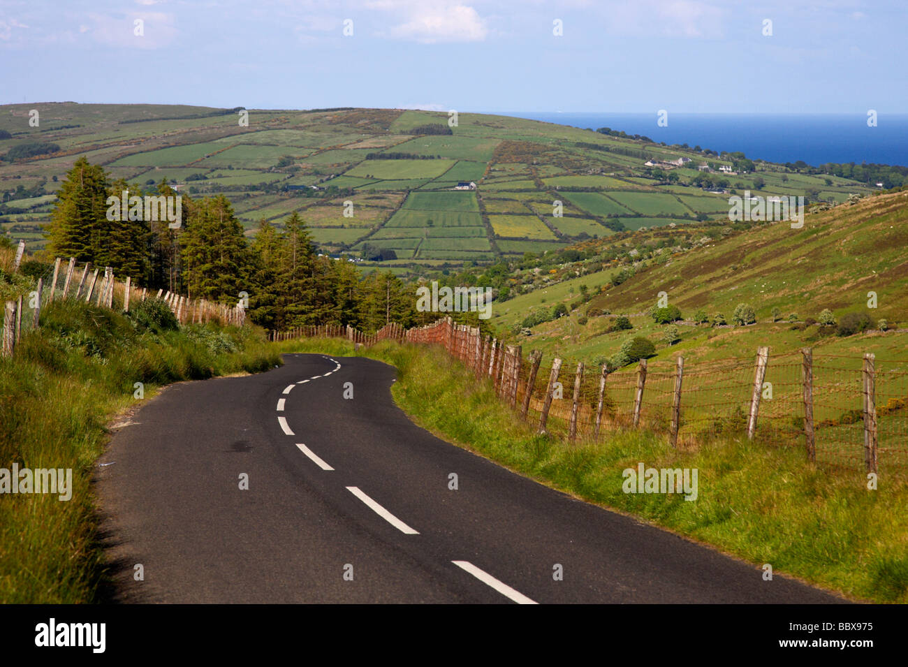 twisty country mountain road through glenaan scenic route glenaan county antrim northern ireland uk Stock Photo
