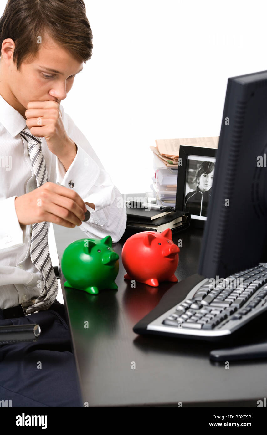 A boy with a piggy bank Stock Photo - Alamy