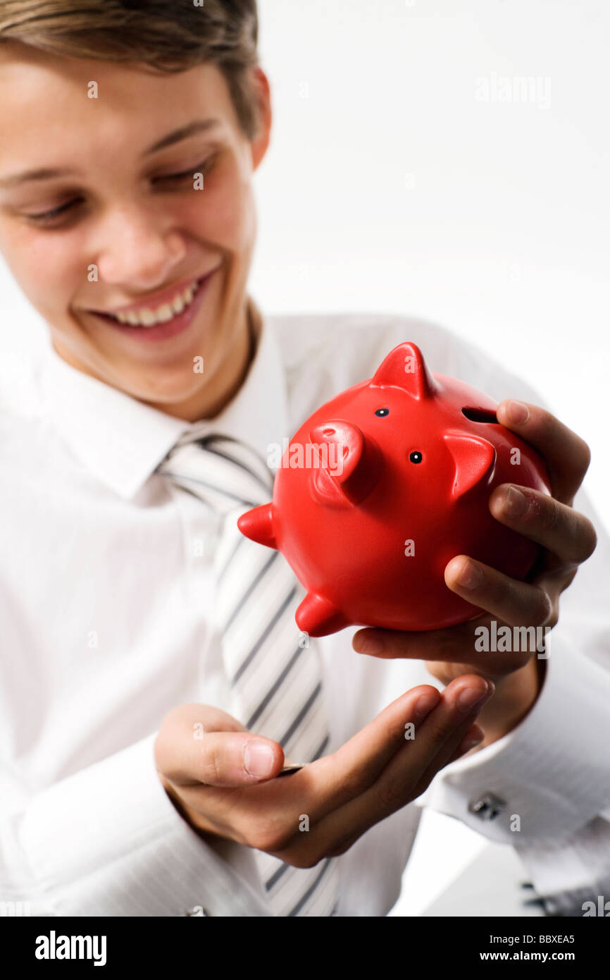 A boy with a piggy bank Stock Photo - Alamy