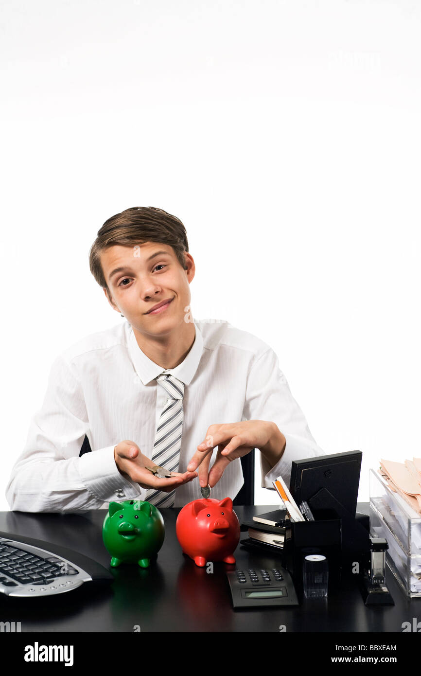 A boy with a piggy bank Stock Photo - Alamy