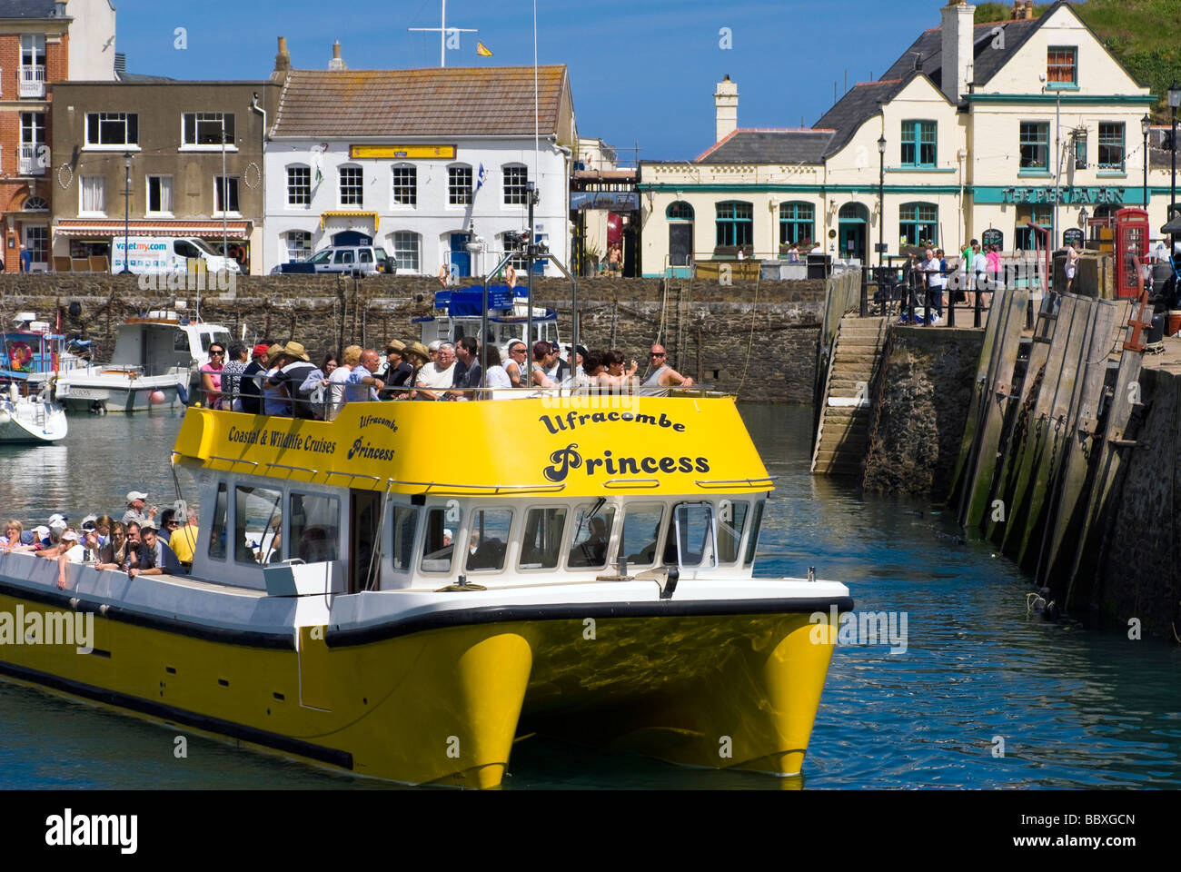 Ilfracombe Princess catamaran boat offering coastal & wildlife cruises. Cruise boat with people, Ilfracombe harbour, Devon, UK. Stock Photo