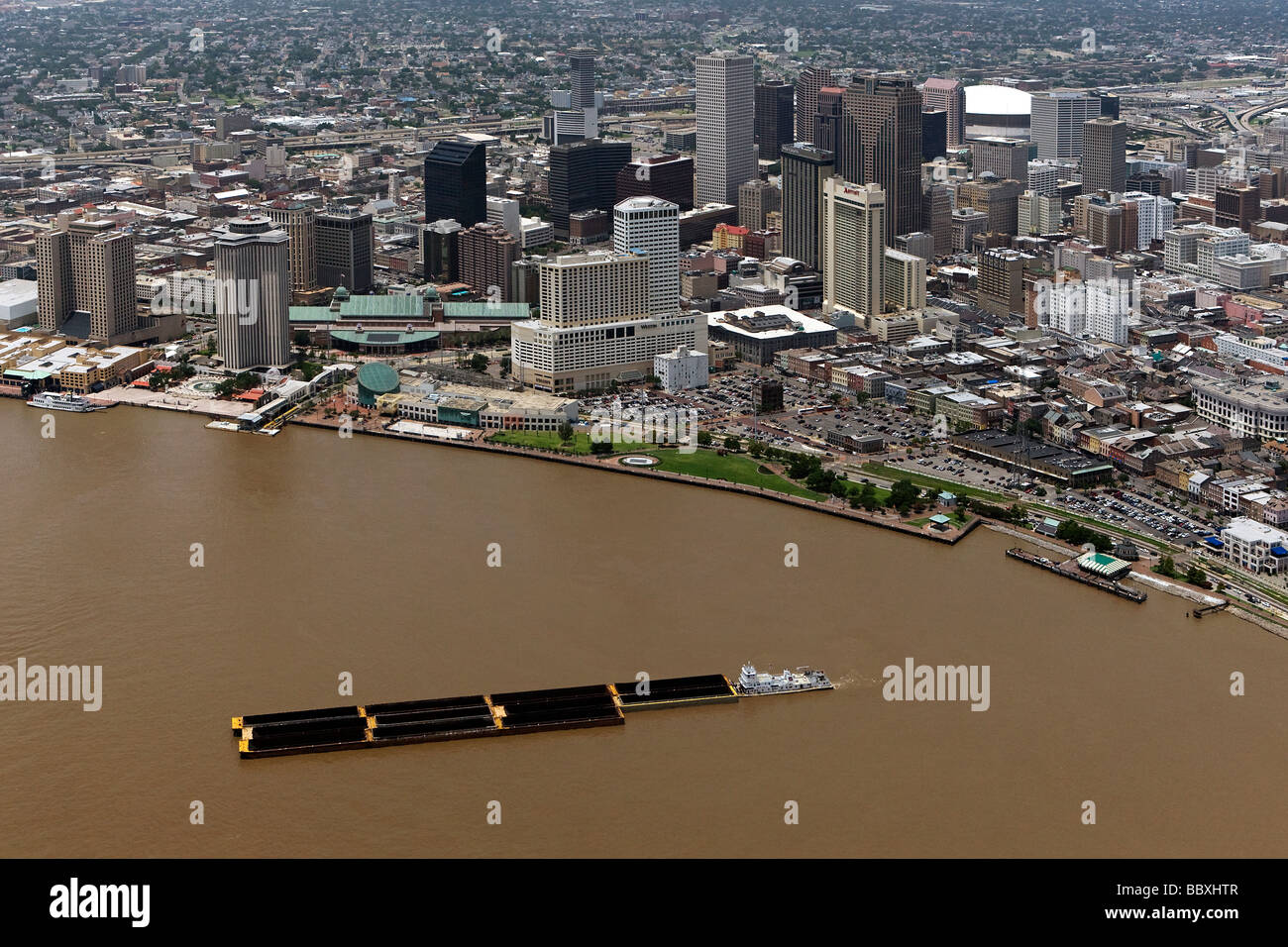 aerial view above tugboat pushing barge Mississippi river New Orleans Louisiana Stock Photo
