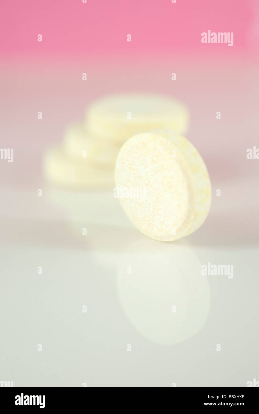 Vitamin pills on pink background Stock Photo