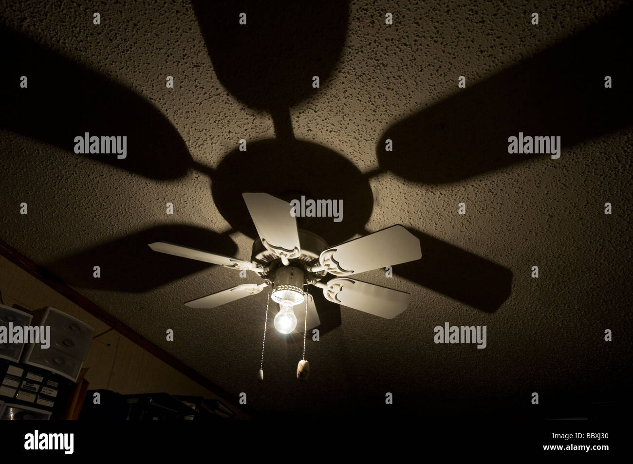 ceiling fan and light with shadows Stock Photo Alamy