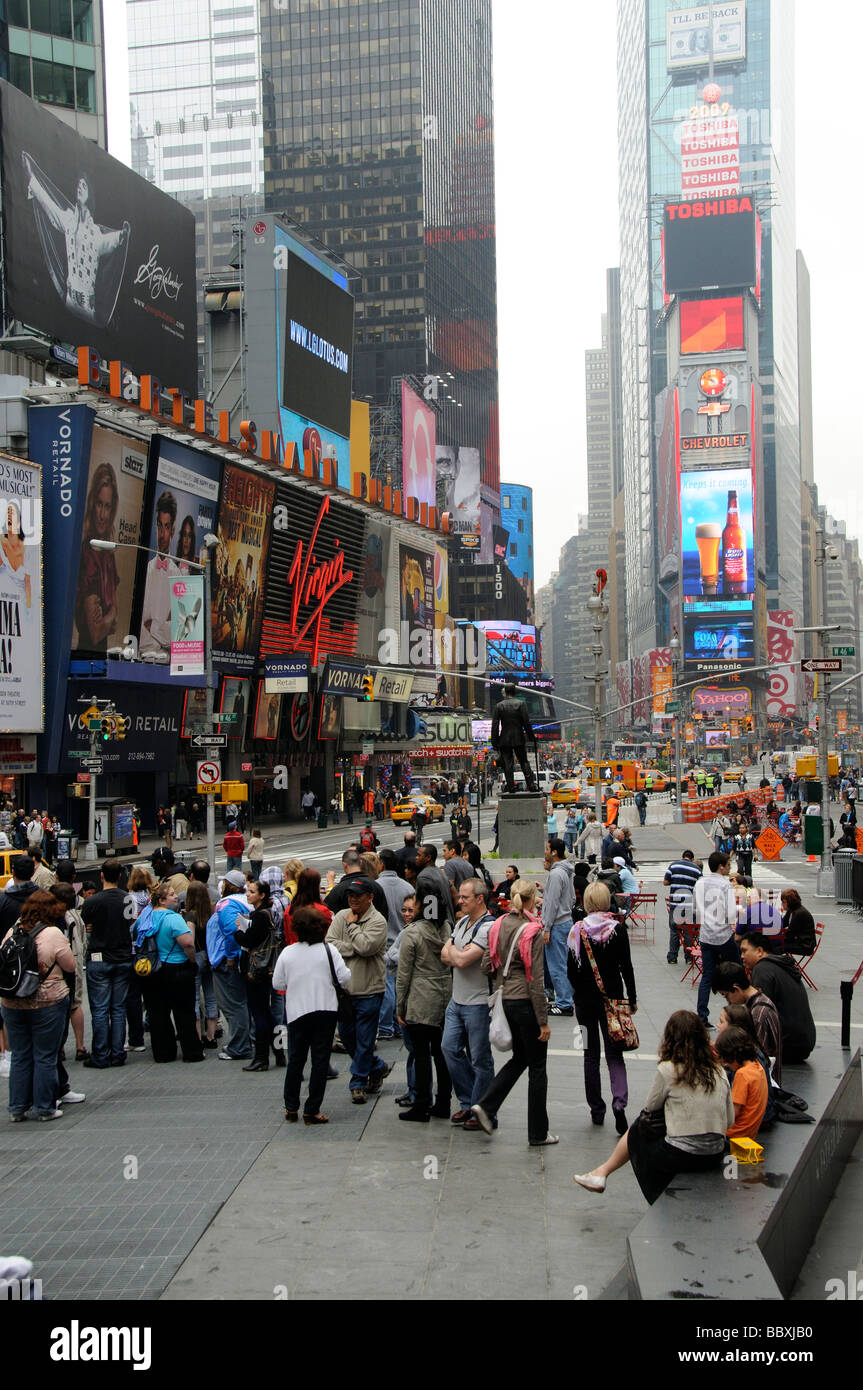 Broadway Times Square New York USA visitors mingle in this popular theatre district area. Stock Photo