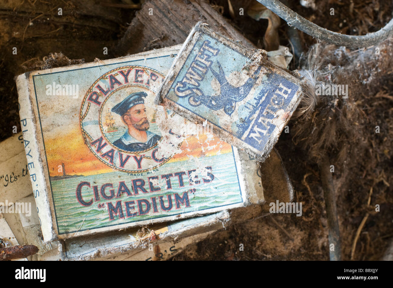 Old packet of Players Navy Cut Cigaretters and Swift matches, left behind during the 1950s or 1960s Stock Photo