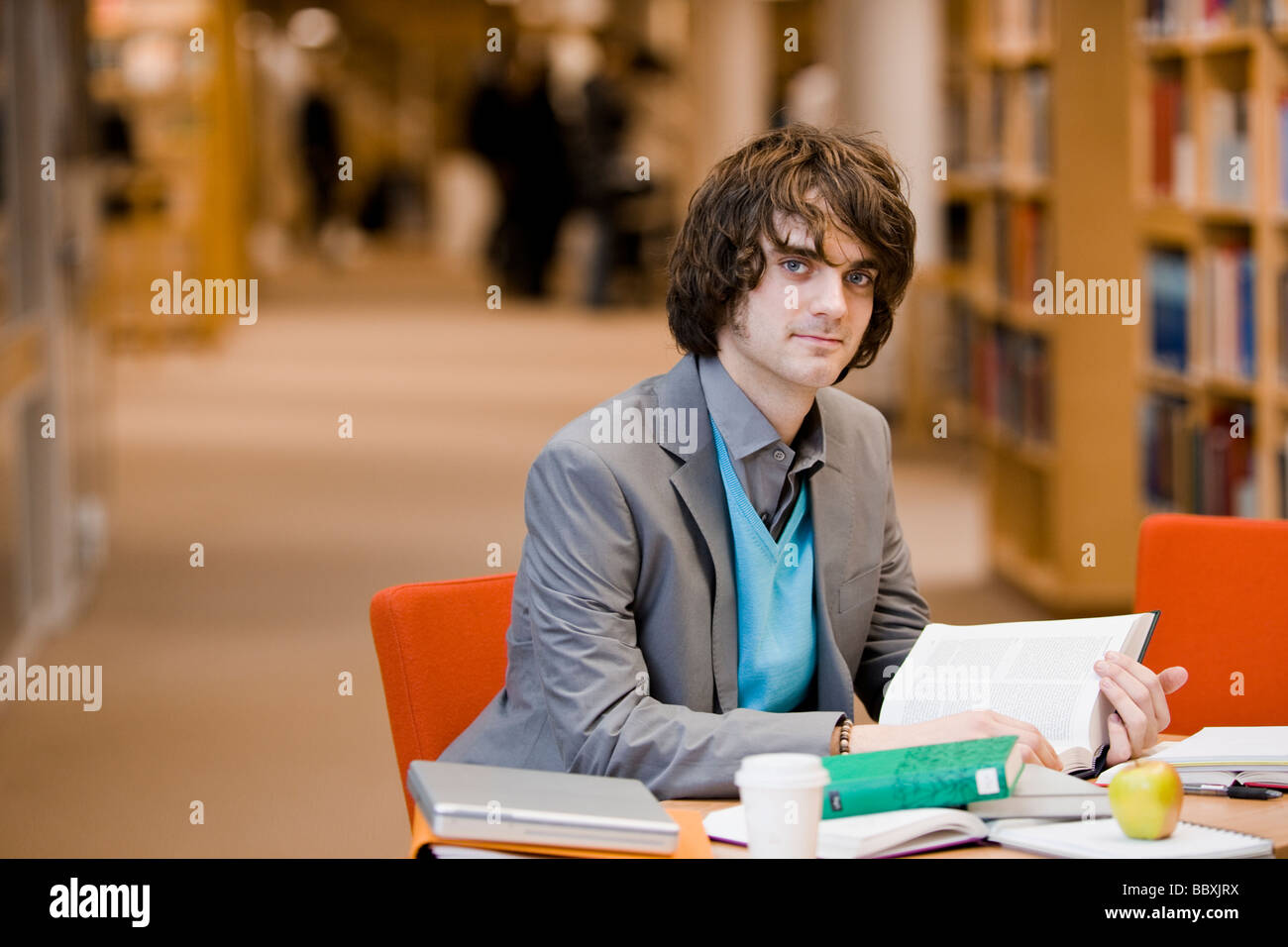 A male student in a library Sweden. Stock Photo