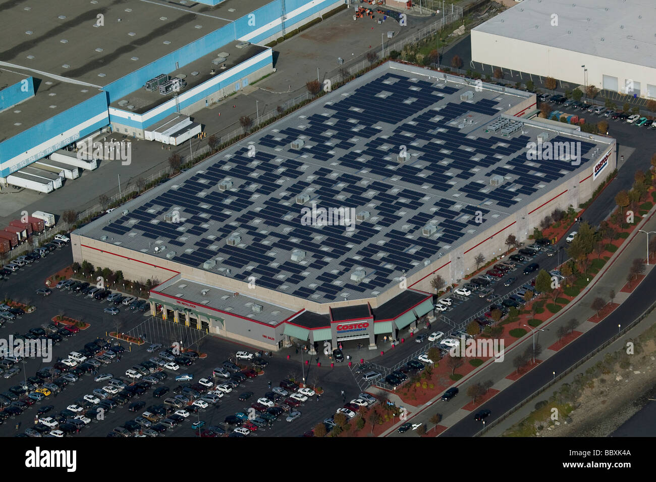 aerial view above solar power panels Costco warehouse rooftop Richmond California Stock Photo