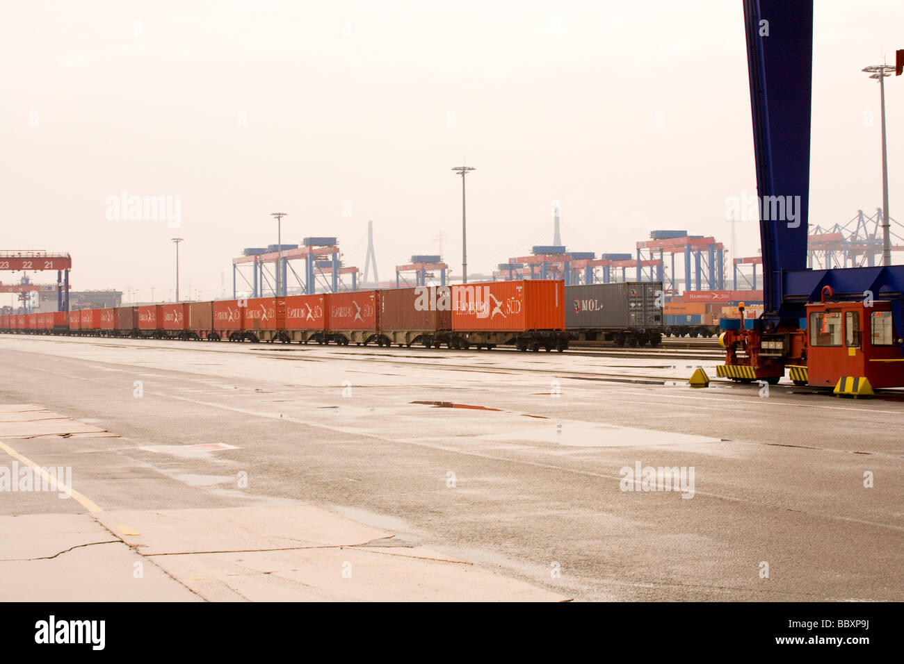 Intermodal ship-to-rail container freight on a port railway network waiting for transit. Stock Photo