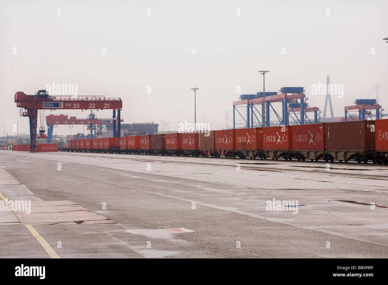 Intermodal ship-to-rail container freight on a port railway network waiting for transit. Stock Photo
