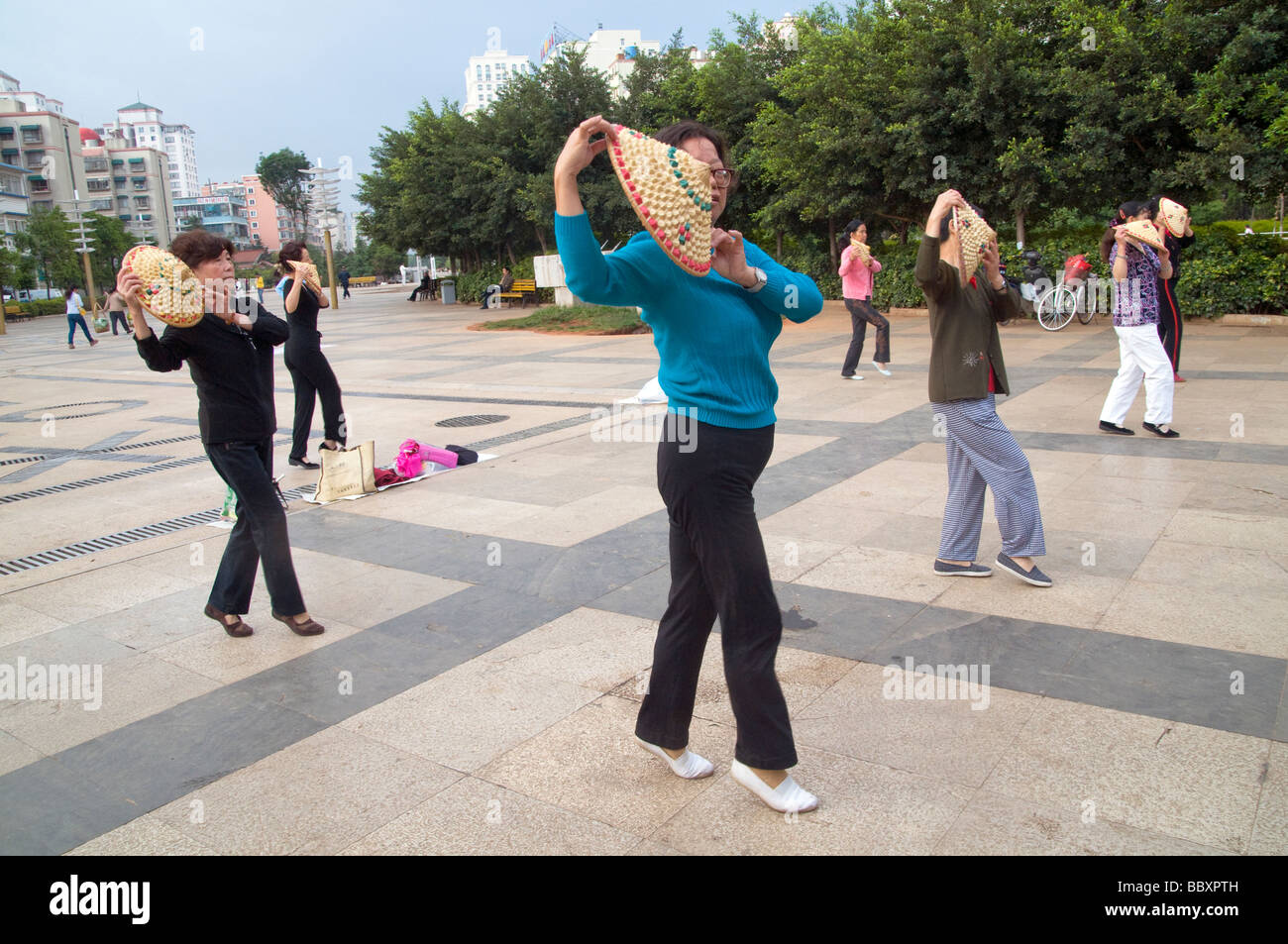 CHINA Elderly people practicing Tai Chi and other martial arts in a park in Kunming Yunnan province Photo by Julio Etchart Stock Photo