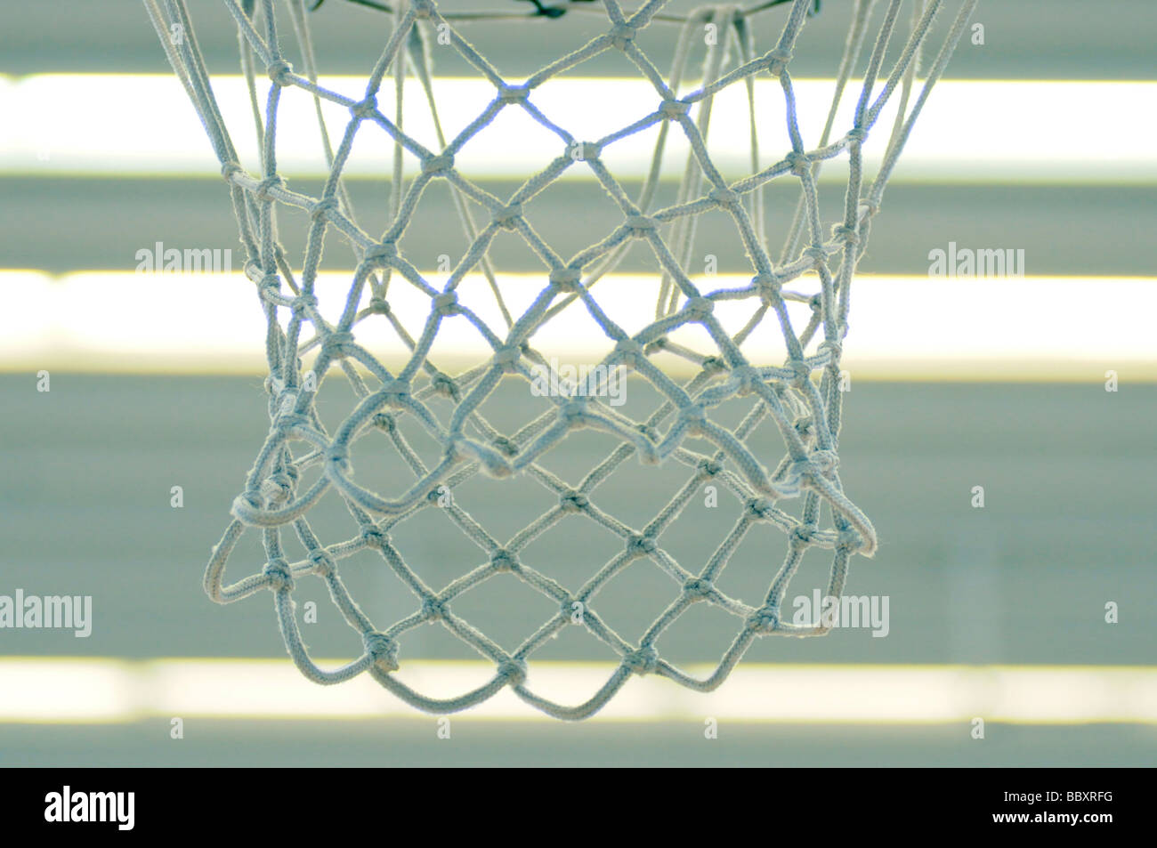 Royalty free photograph of basketball netball net hanging in sports hall. london UK Stock Photo