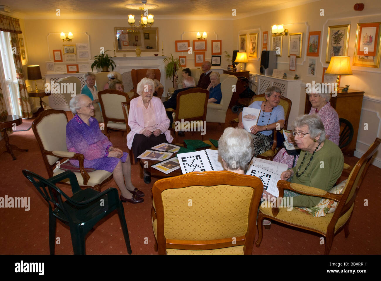 Group of elderly people in communal lounge of old age pensioners care home, Alton, Hampshire, UK. Stock Photo