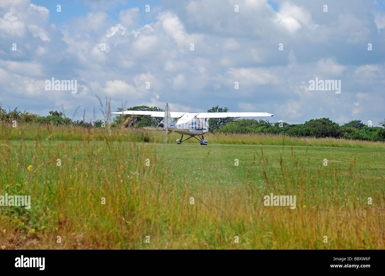 microlight aircraft taxing on grass airfield at popham hampshire. Stock Photo