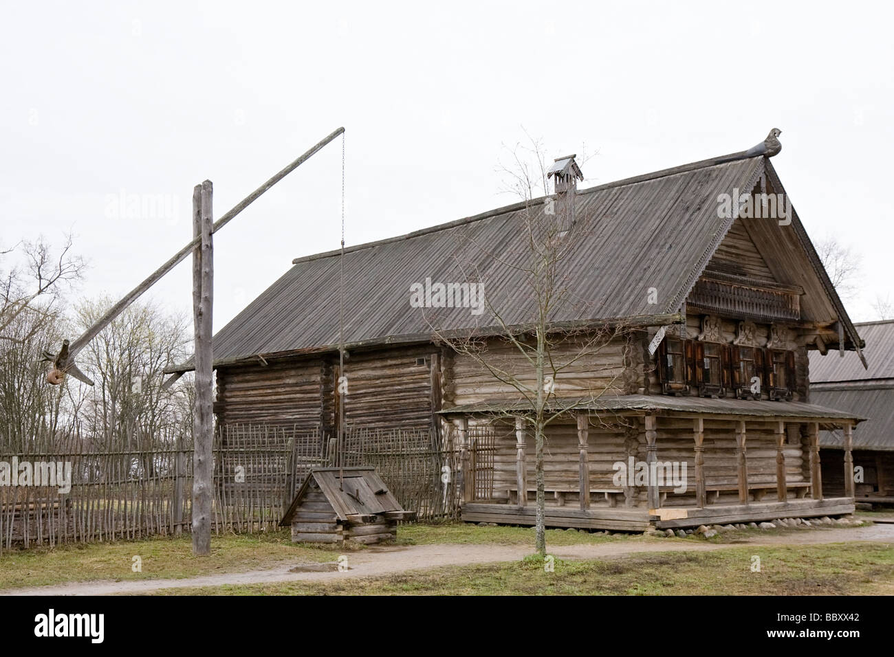 big wooden house and well in Russian village Stock Photo - Alamy