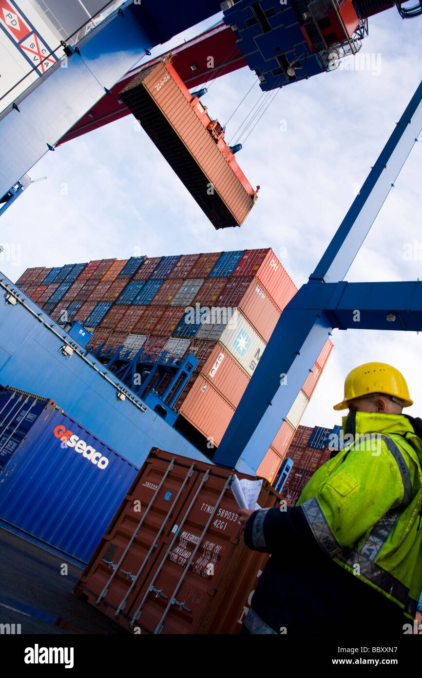 A Post-Panamax crane unloads containers at a European port. Stock Photo