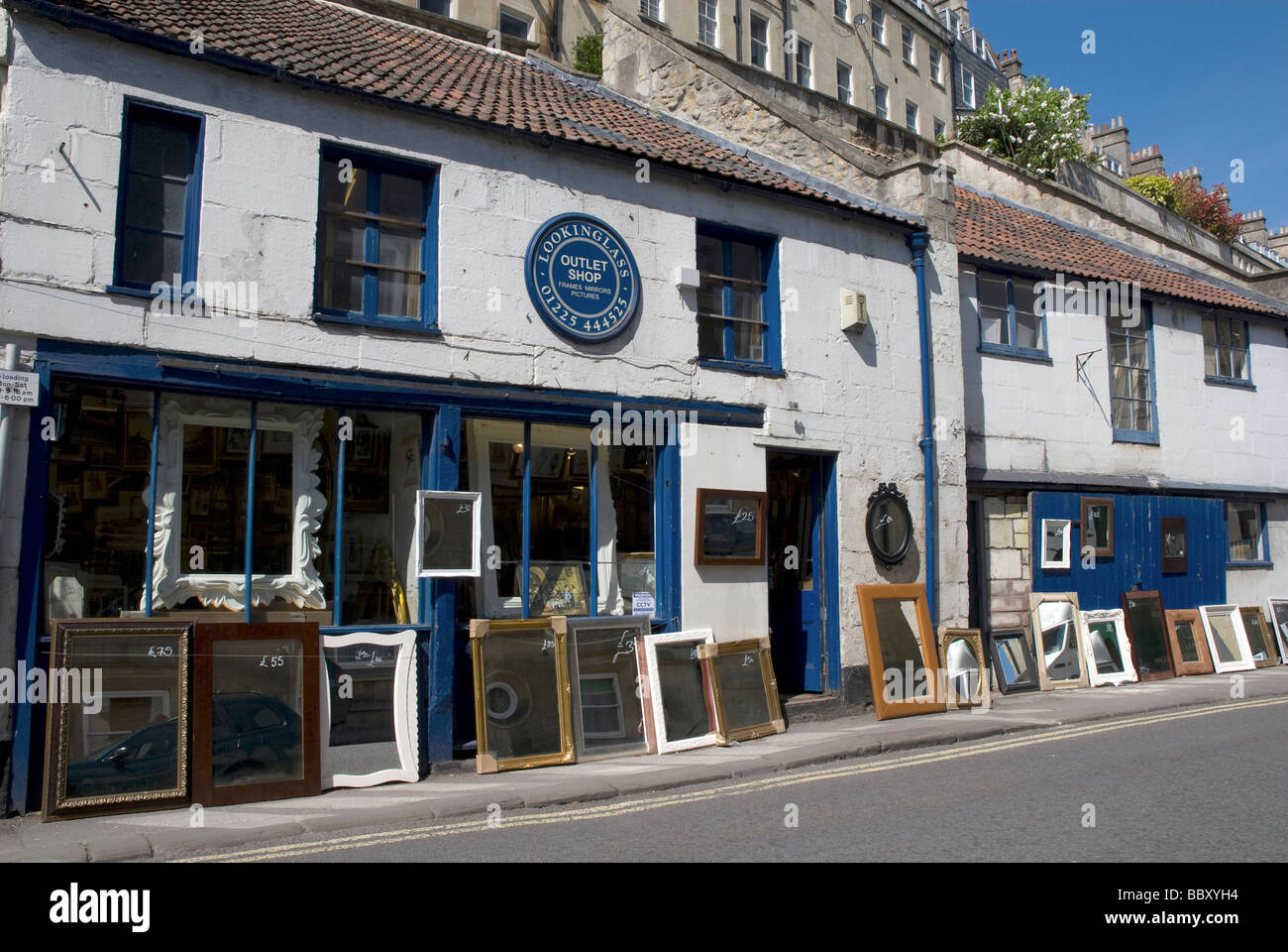 Street display of mirrors for sale outside a shop in Walcot Street Bath