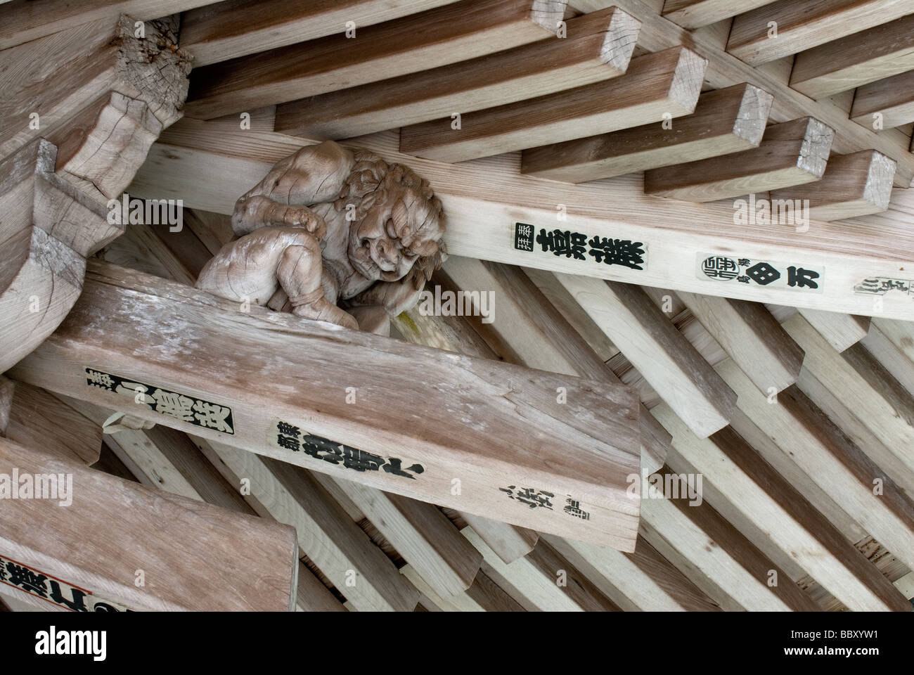 A gnome or gargoyle or troll sitting under the roof overhang of Engyoji Temple in Hyogo Prefecture near Himeji Stock Photo