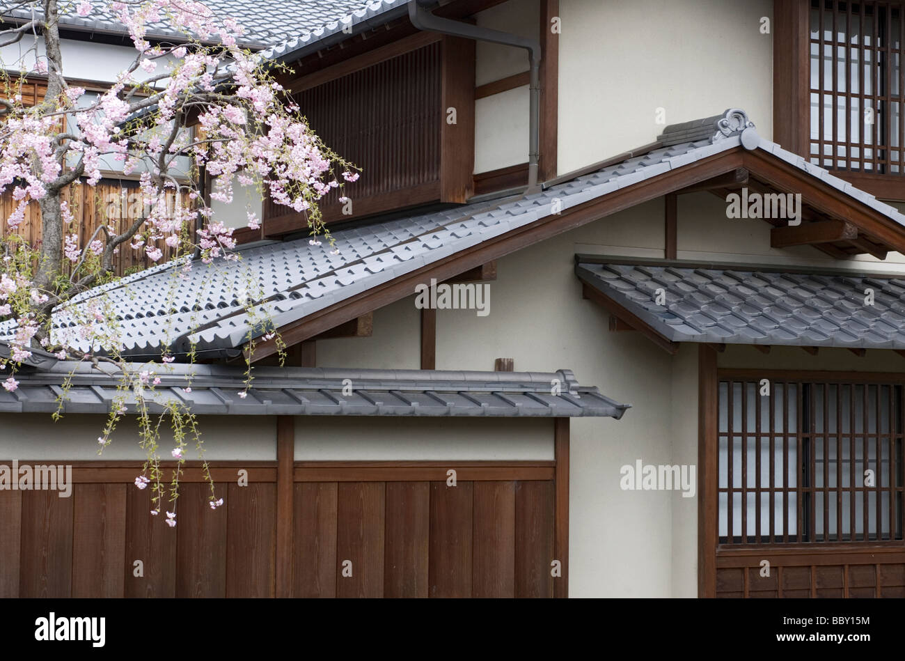 An upscale two story single family Japanese residence with multiple roof lines and traditional detailing Stock Photo