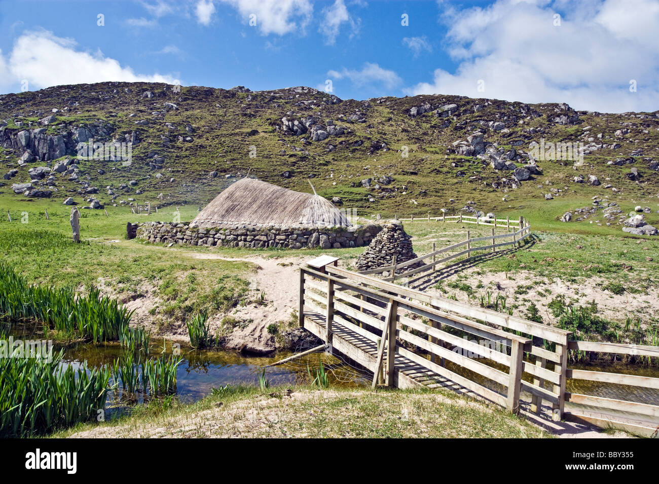 Reconstructed Iron Age House at Bostadh beach on the west coast of the Isle of Lewis in the Outer Hebrides Scotland Stock Photo