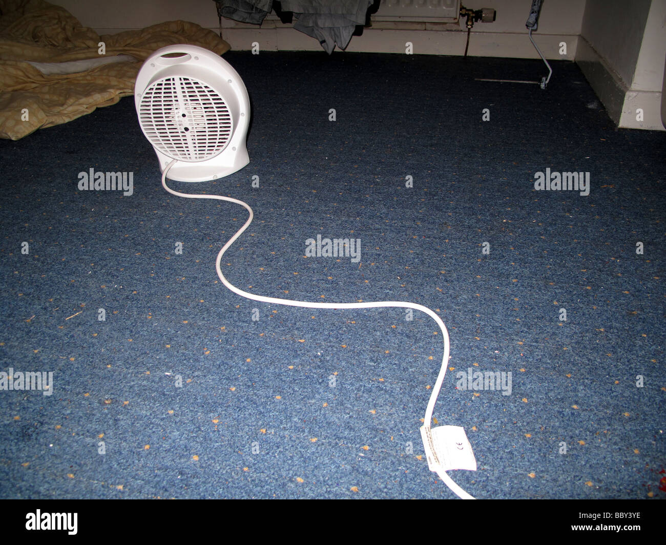 Portable lectric fan heater on floor with cable Stock Photo