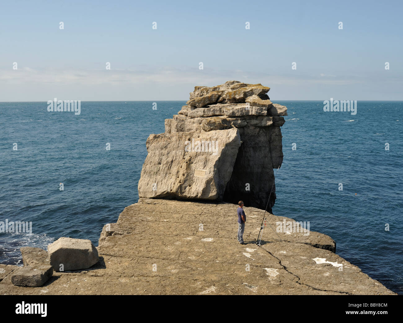 Fisherman on Pulpit Rock, Portland Bill Stock Photo