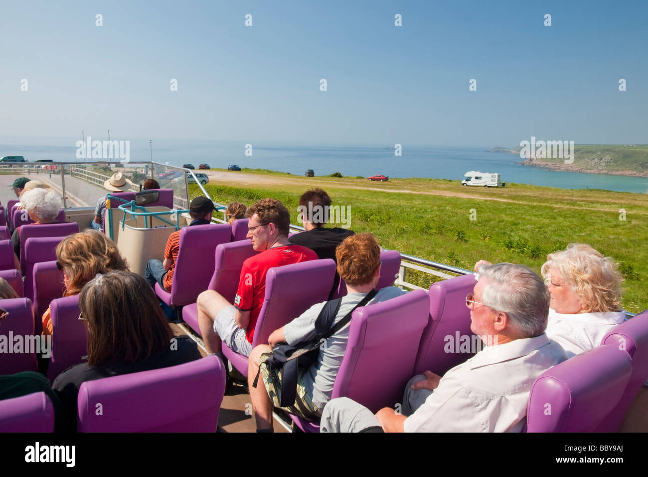 Tourists on an open topped bus at Lands End in cornwall UK Stock Photo