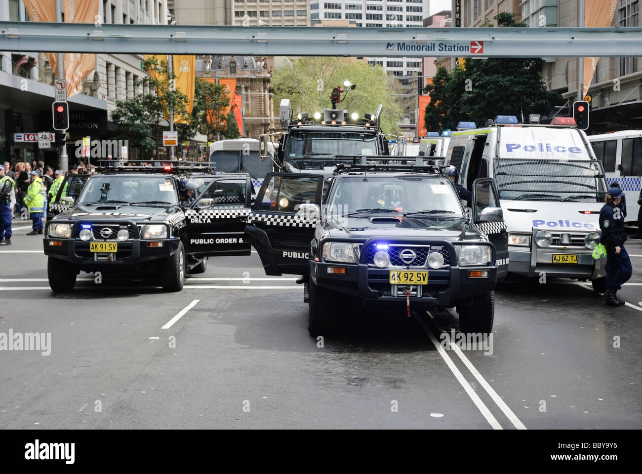 Police riot squad in formation, with water canon at centre. Stock Photo