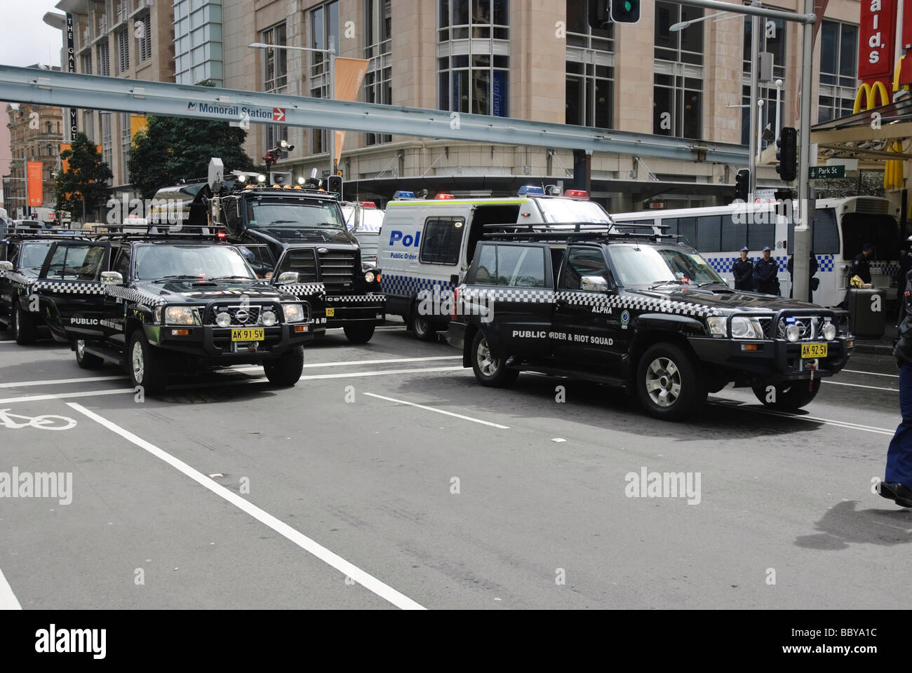 Police riot squad in formation, with water canon at centre. Stock Photo